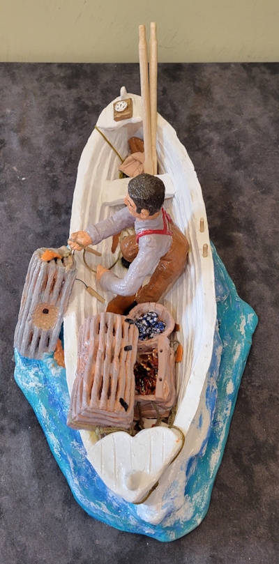 a fisherman hauling traps by hand
