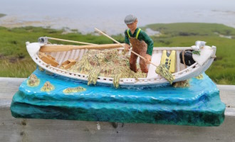 A fisherman harvestng seaweed - sold